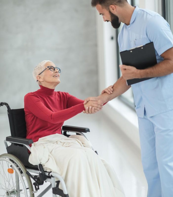 healthcare-worker-with-old-aged-woman-in-wheelchair